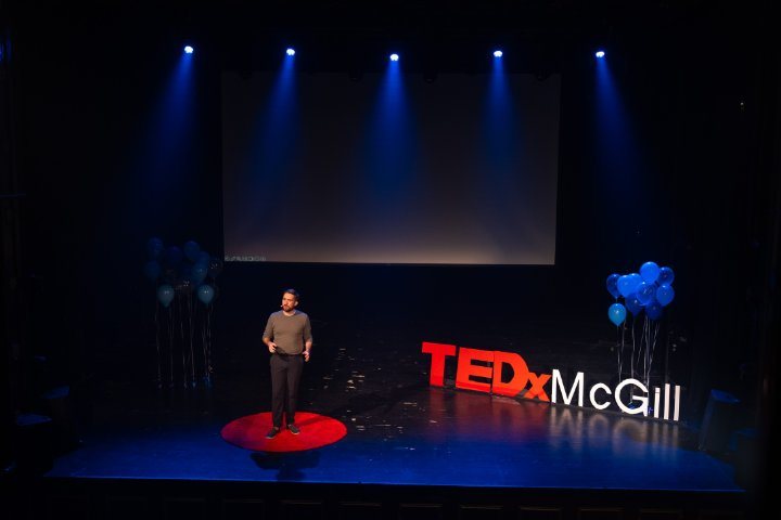 Charlie on stage at TEDxMcGill